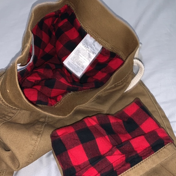 Old Navy pants lined with plaid black and red fabric. - Picture 2 of 6